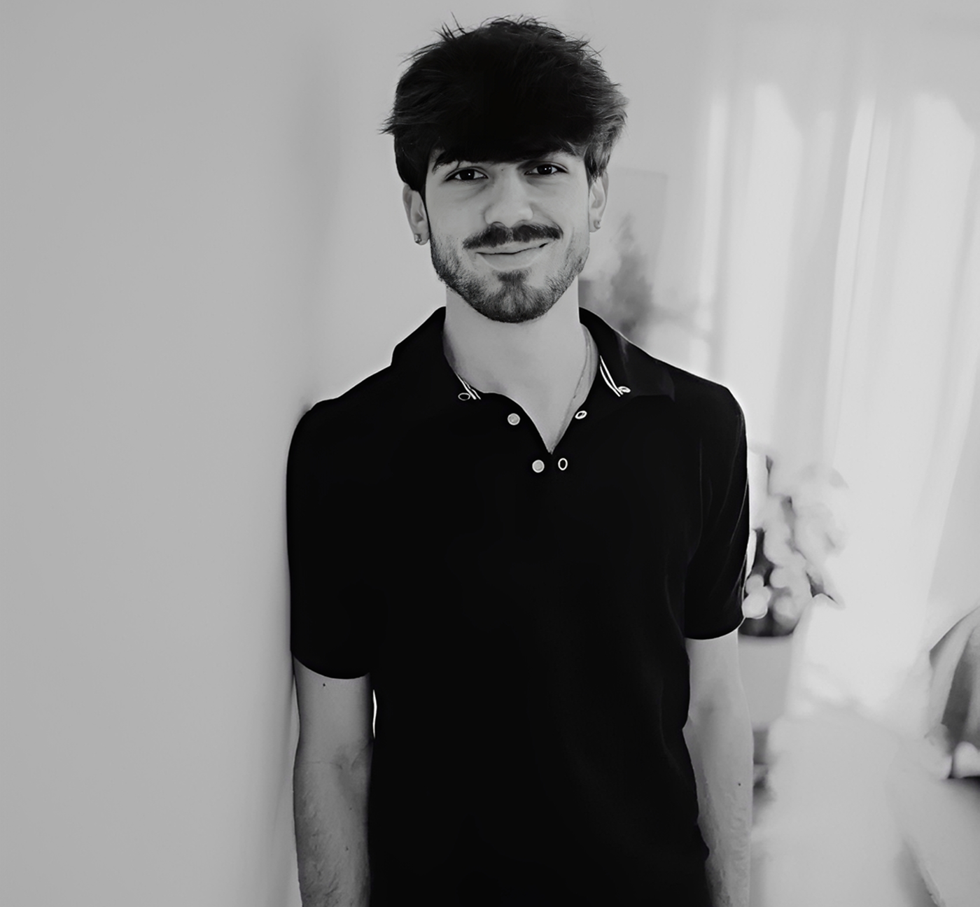 Person standing against a wall